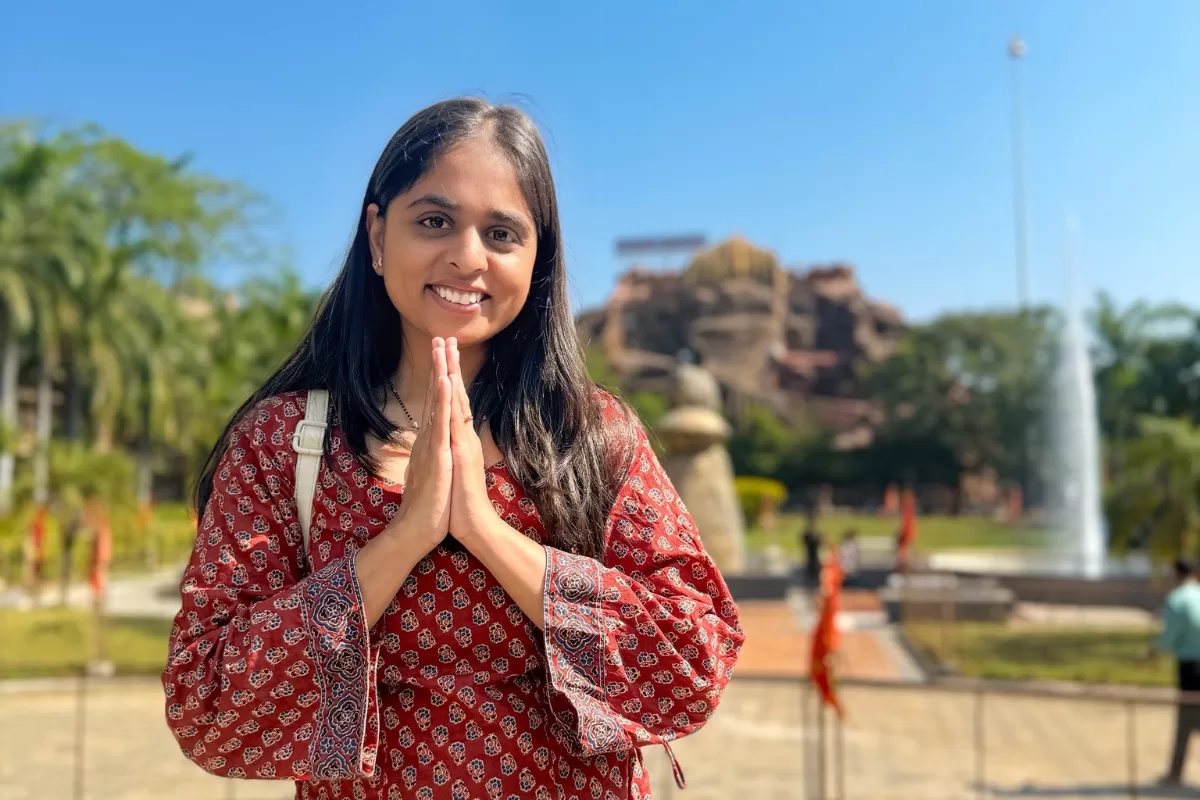 Woman offering namaste at Siddhi Vinayak Temple Mahemdavad during a peaceful temple visit