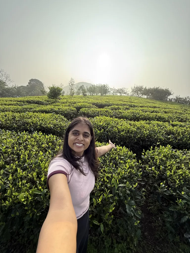 Woman taking selfie in tea plantation in Idukki Kerala