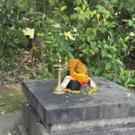 Decorated Shiva lingam with marigold flowers in Kerala temple