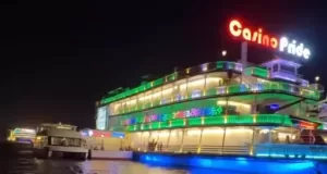 Casino Pride cruise ship illuminated at night on Mandovi River in Goa