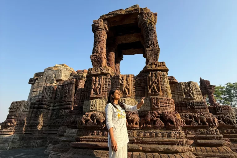 Woman exploring the ancient carvings of Ratneshwar Mahadev Temple in Ratanpur Gujarat