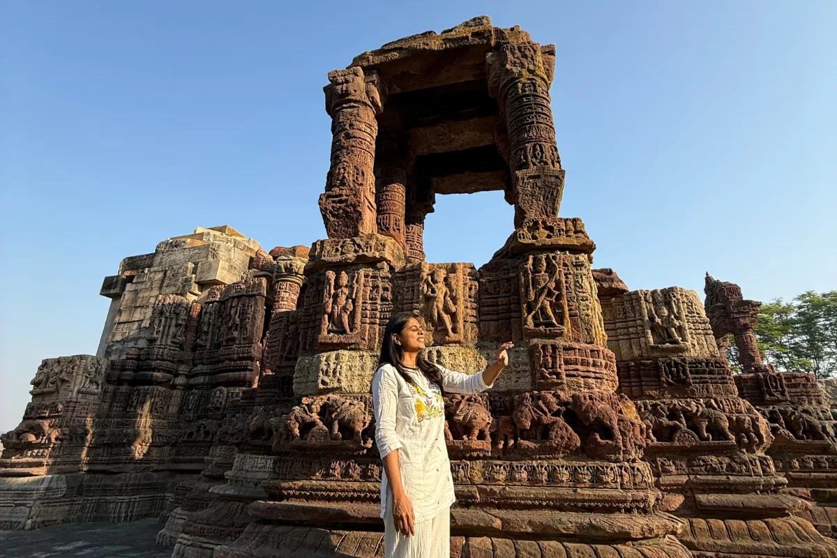 Woman exploring the ancient carvings of Ratneshwar Mahadev Temple in Ratanpur Gujarat