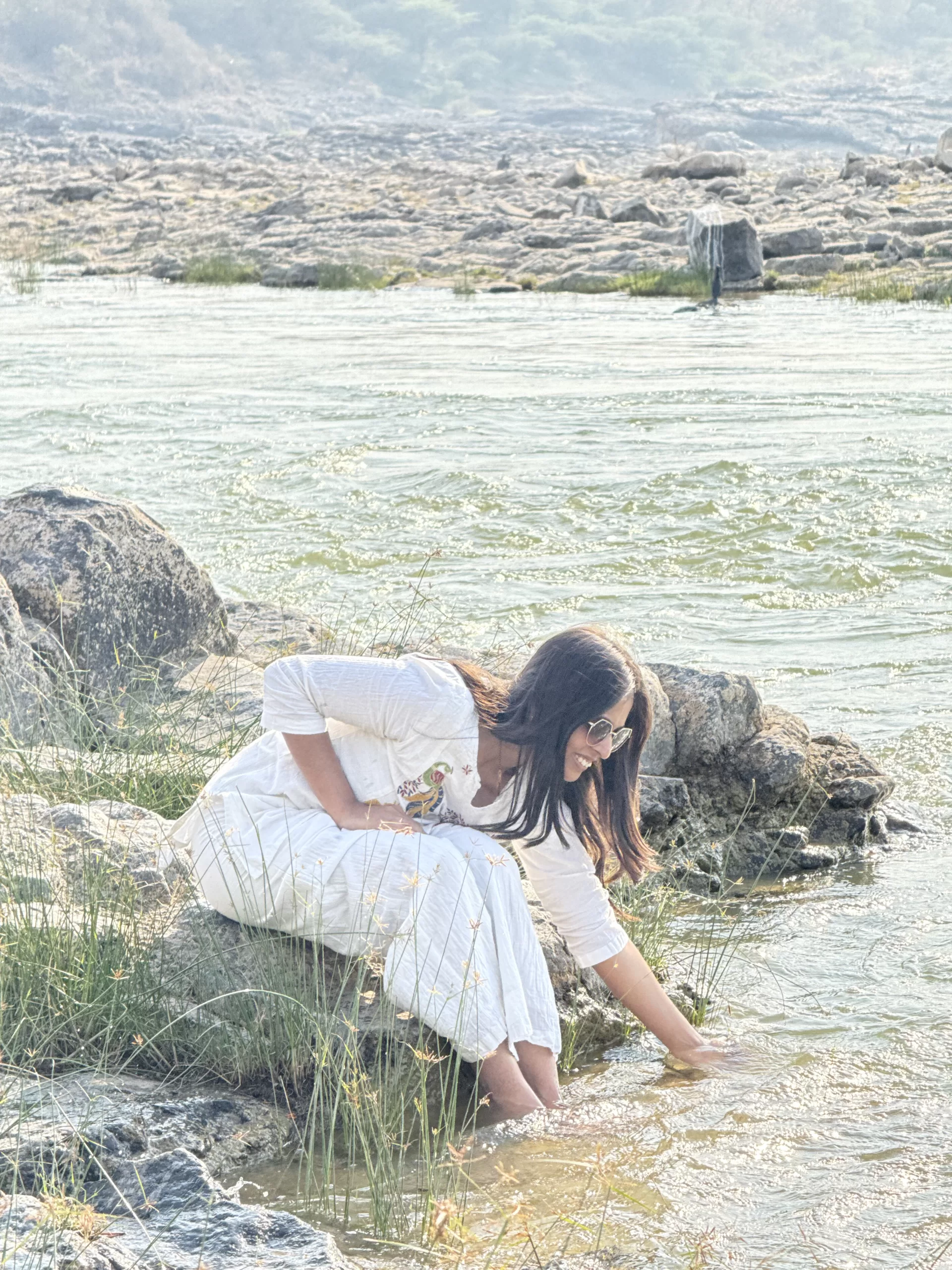 Woman enjoying riverside at Lanchhanpur river during a one day trip near Vadodara Gujarat
